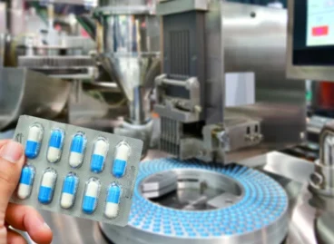 hand-holding-blue-capsule-pack-medicine-pill-productionline