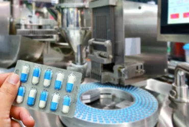 hand-holding-blue-capsule-pack-medicine-pill-productionline