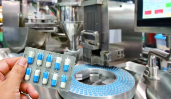 hand-holding-blue-capsule-pack-medicine-pill-productionline